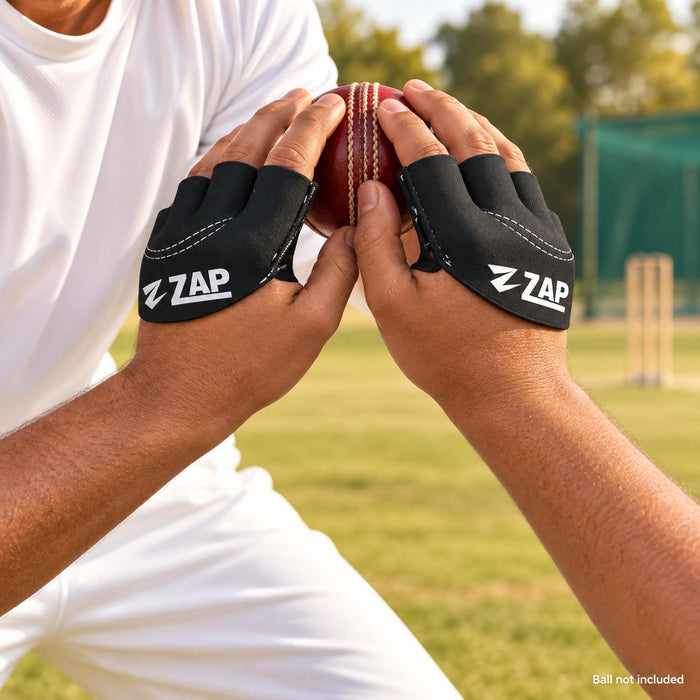Cricketer using ZAP black fielding gloves during a low fielding catch