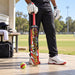 CA Gold Revolution tape ball bat - cricket ground lifestyle view
