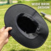 Black CA cricket Panama hat underside showing the stitched wide brim