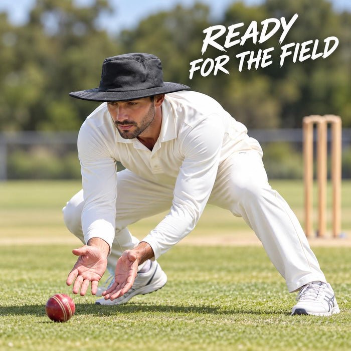 Adult cricketer wearing the black CA wide brim Panama hat while fielding
