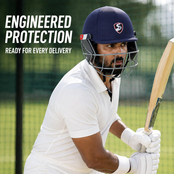 Adult cricketer wearing SG Aerotuff navy blue cricket helmet during play