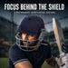 Adult cricketer wearing SG Pro Shield navy blue cricket helmet during play