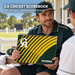 Coach holding the green and yellow CA 100 Innings Cricket Scorebook