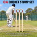 CA wooden cricket stumps and bails installed behind a batter during cricket practice