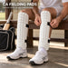 Cricketer fitting white CA Fielding Pads with two black straps before wearing trousers
