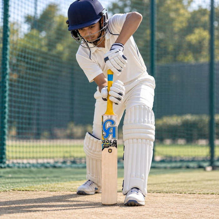 Cricketer using the CA Gold 1000 English Willow Junior Cricket Bat - Harrow during practice in cricket nets