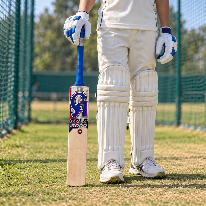 CA Gold 3000 English Willow Bat Size Harrow held upright by a cricketer before practice