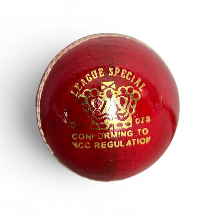 CA League Special red leather cricket ball showing gold crown branding and stitched seam