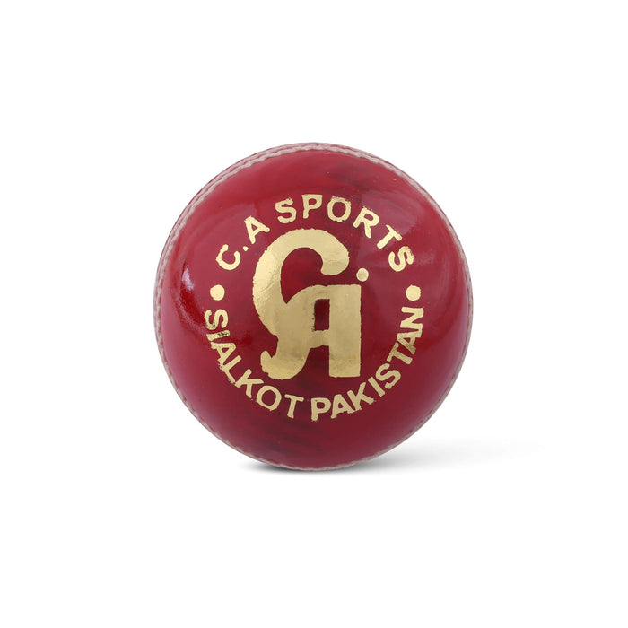 CA Super Test red cricket ball showing gold CA Sports Sialkot Pakistan logo and white stitching
