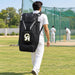 Cricketer carrying a CA Plus 18K black duffle kit bag with both shoulder straps