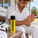 Griptec Instant Grip Spray 200ml beside a cricketer preparing hands before play