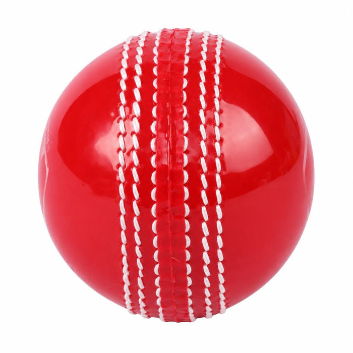 SG Supasoft red synthetic cricket ball white seam close-up