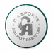White leather cricket ball with CA Sports branding and green seam