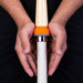 Hands demonstrating grip transfer with cone and bat handle
