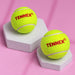 Two green Tennex cricket tennis balls on display stands