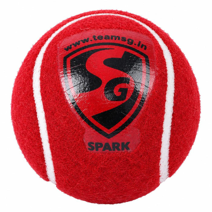 SG Spark red cricket tennis ball front close-up with SG logo and white seams