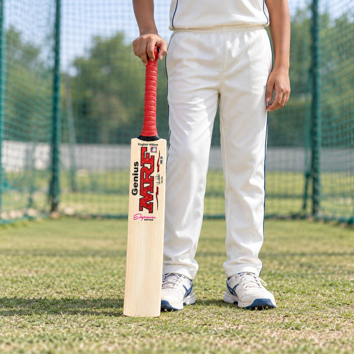 MRF Genius Empower Edition English Willow Cricket Bat - Junior Size 6 (Six) held upright by a cricketer before practice