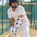 Adult batter wearing the white segmented MRF Molded forearm elbow guard with black straps