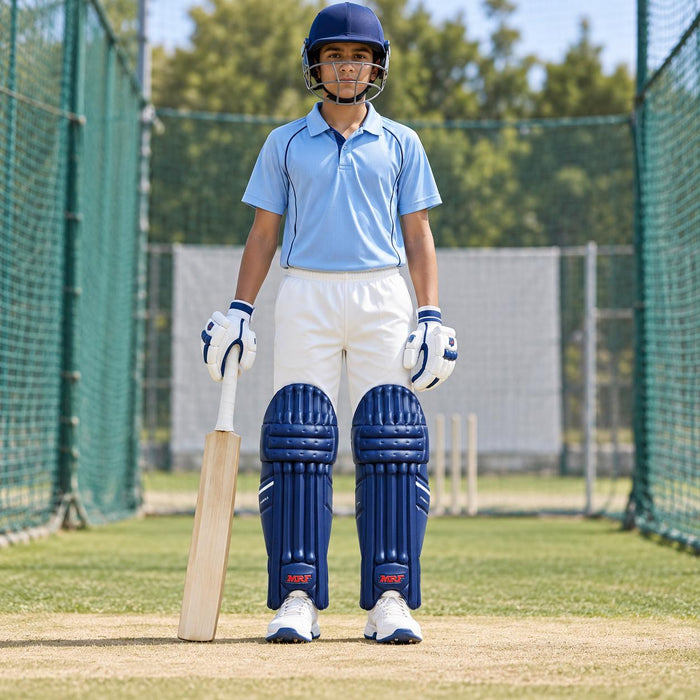 MRF Power 2.0 blue batting leg guards worn by a youth cricketer on a practice pitch