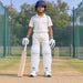 MRF Power 3.0 white batting leg guards worn by a junior cricketer on a practice pitch