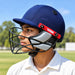 Junior cricketer wearing the blue MRF Prodigy helmet with black grille and red side plates