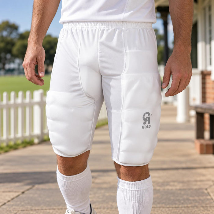 CA Padman white padded cricket shorts shown worn with a white shirt - front view