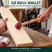 SG ball mallet gently knocking the flat front face of a straight cricket bat
