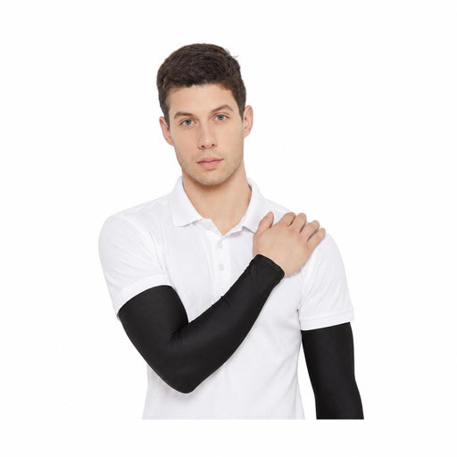 SG Century black cricket arm sleeves worn with a white short-sleeved polo - front view
