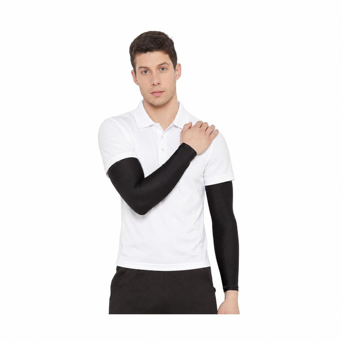 SG Century black cricket arm sleeves worn with a white polo and black trousers