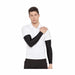 SG Century black cricket arm sleeves worn with a white polo and black trousers