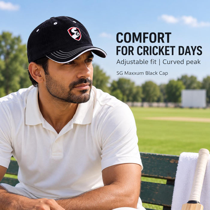 Adult cricketer wearing the SG Maxxum Black Cricket Cap beside the cricket ground between practice sessions