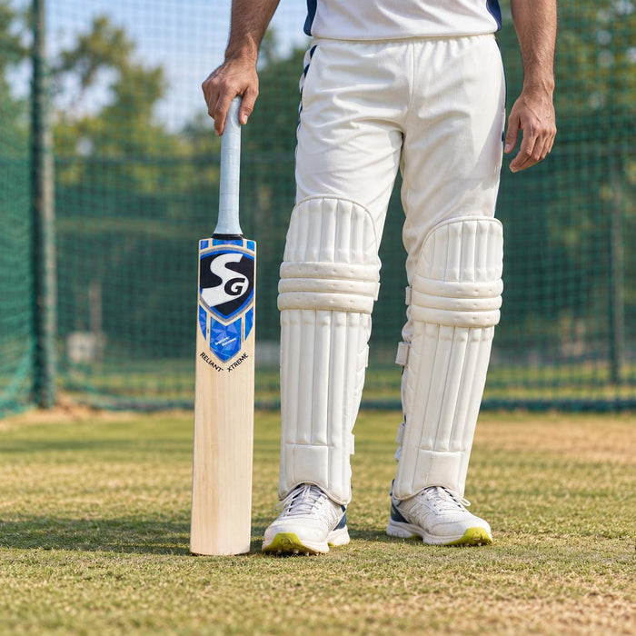 SG Reliant Xtreme English Willow Cricket Bat- SH held upright by a cricketer before practice