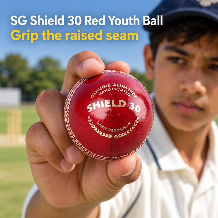 SG Shield 30 Red Youth Leather Cricket Ball - hand and raised seam grip detail