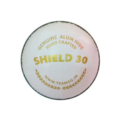 SG Shield 30 white youth cricket ball showing gold model and hand-crafted markings