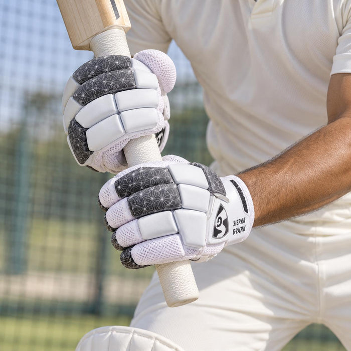 SG Sierra Spark batting gloves worn by an adult cricketer - grip around the bat handle