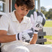 SG Sierra Spark batting gloves worn by a junior cricketer - adjusting the wrist fastening