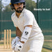 Adult batter wearing a white SG Super Test forearm elbow guard in cricket nets
