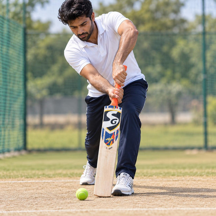 Cricketer using the SG T-1600 Kashmir Willow Tennis Scoop Bat - SH during practice in cricket nets
