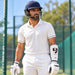 Adult cricketer wearing an SG Test forearm elbow guard in cricket nets
