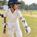 Boy wearing an SG Test forearm elbow guard while preparing to bat
