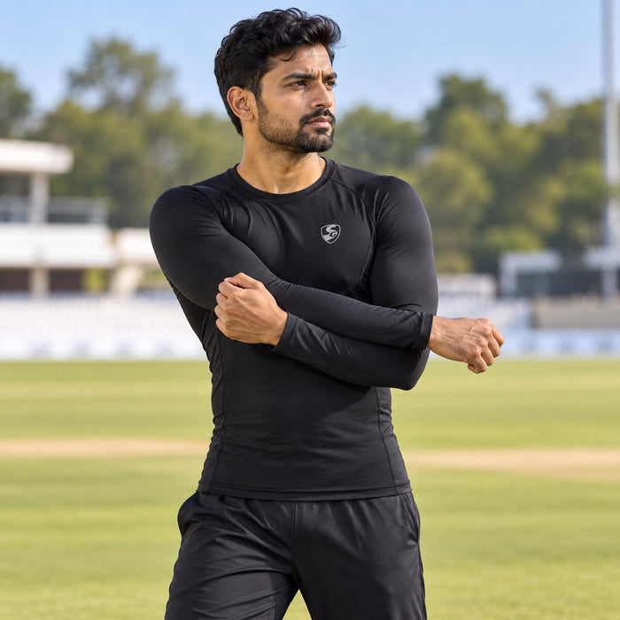 SG Xtreme black long-sleeve compression top worn during a cricket warm-up