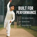 Junior cricketer bowling in the Sportiff long sleeve white shirt and trouser set