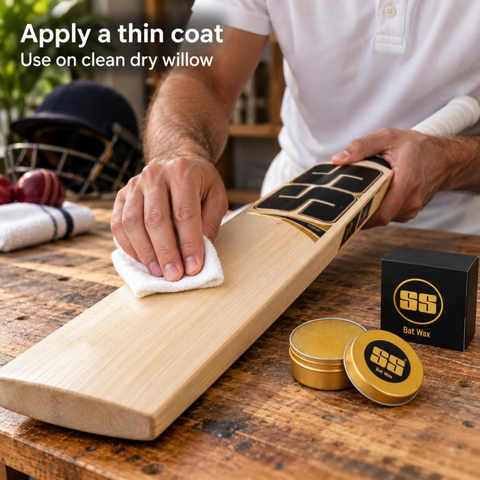 Cricketer applying SS Bat Wax sparingly with a soft cloth to the exposed willow face of a cricket bat