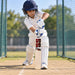 Junior cricketer using the SS Master Size 3 bat during practice in cricket nets