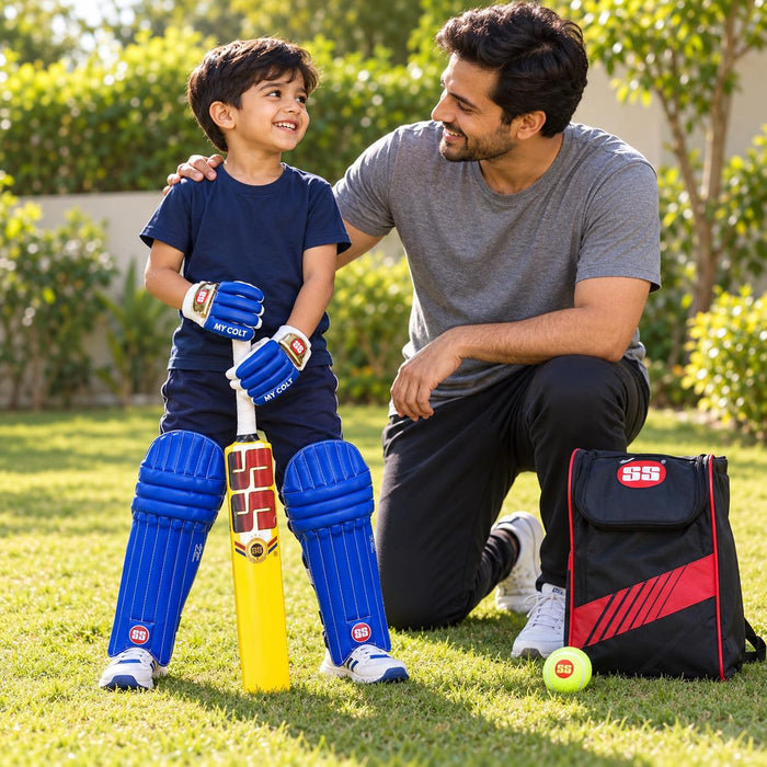 SS My Colt Size 0 blue pads and gloves with yellow plastic bat used by a junior cricketer