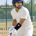Adult cricketer wearing the black SS Premium Pro wrist guard above the batting glove in cricket nets