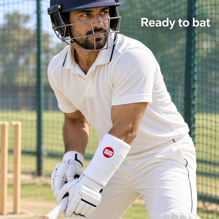 Adult cricketer wearing the white SS Premium Pro wrist guard above the batting glove in cricket nets