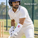 Adult cricketer wearing the white SS Premium Pro wrist guard above the batting glove in cricket nets