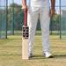 SS Sword English Willow Cricket Bat -SH held upright by a cricketer before practice