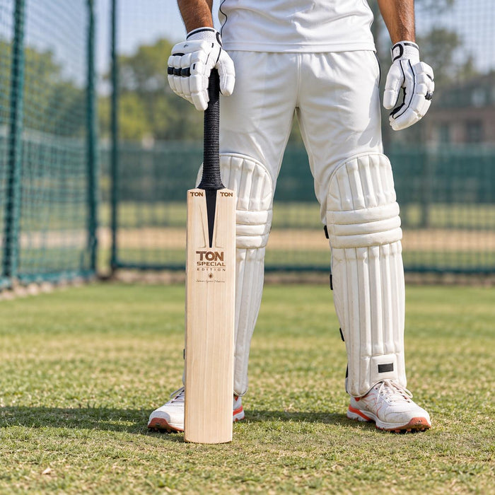 SS Ton Special Edition English Willow Cricket Bat - SH held upright by a cricketer before practice